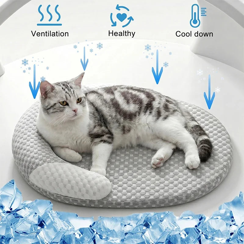 A tabby cat is relaxing on a gray cooling ice silk pet mat, with icons indicating ventilation, healthy benefits, and cool dow