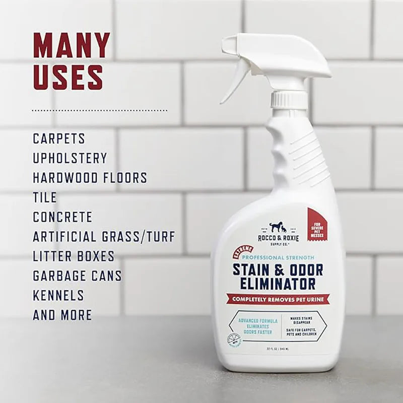 A white spray bottle of Pet Enzyme Stain & Odor Eliminator is shown against a gray tiled background.