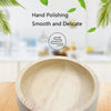 A close-up view of a light wood feeding bowl being hand polished for smoothness and delicacy.