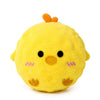 A yellow plush chick toy with orange tufts on its head.