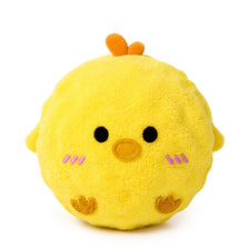 A yellow plush chick toy with orange tufts on its head.