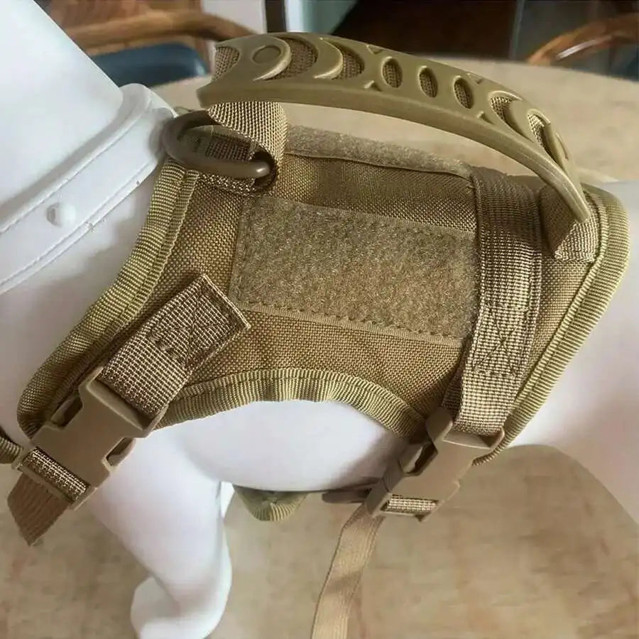 A tan mesh cat harness is shown on a white object, highlighting its adjustable fit and design.