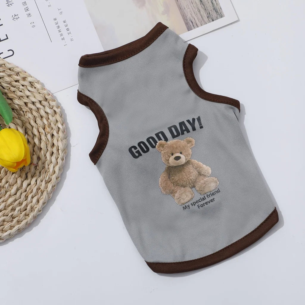 A gray pet vest featuring a cartoon teddy bear design with the text GOOD DAY Forever