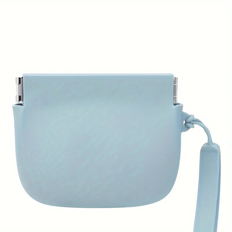 A light blue portable silicone dog treat pouch with a clip and a strap.