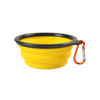 Yellow silicone collapsible pet travel bowl with a black rim and orange strap.