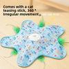 A light blue interactive cat teasing stick toy with a white ball and green feathers on a wooden surface.