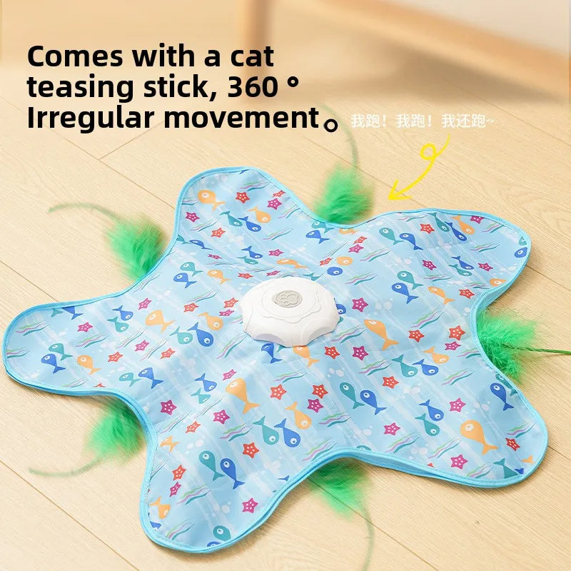 A light blue interactive cat teasing stick toy with a white ball and green feathers on a wooden surface.