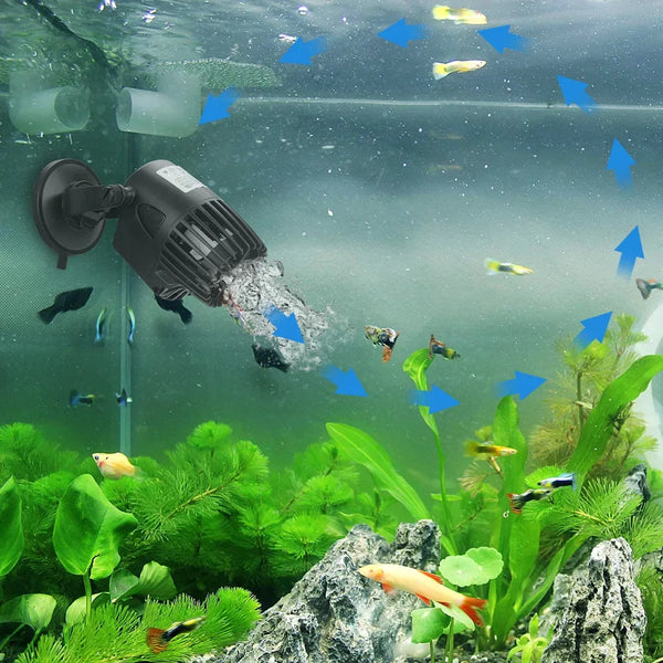 A submersible water circulation pump is visible inside an aquarium tank, with fish and aquatic plants surrounding it.