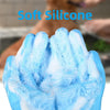 A close-up of blue soft silicone pet grooming gloves being used to clean a dog's paw.