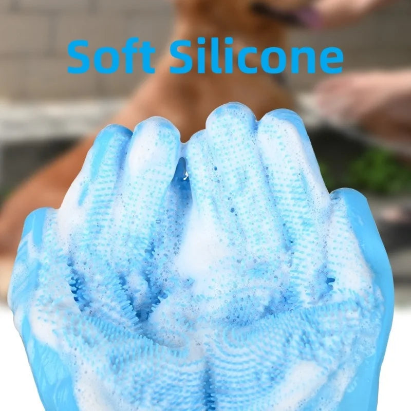 A close-up of blue soft silicone pet grooming gloves being used to clean a dog's paw.