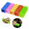 A set of silicone pet hair remover brushes in various colors, including blue, pink, yellow, orange, and green.