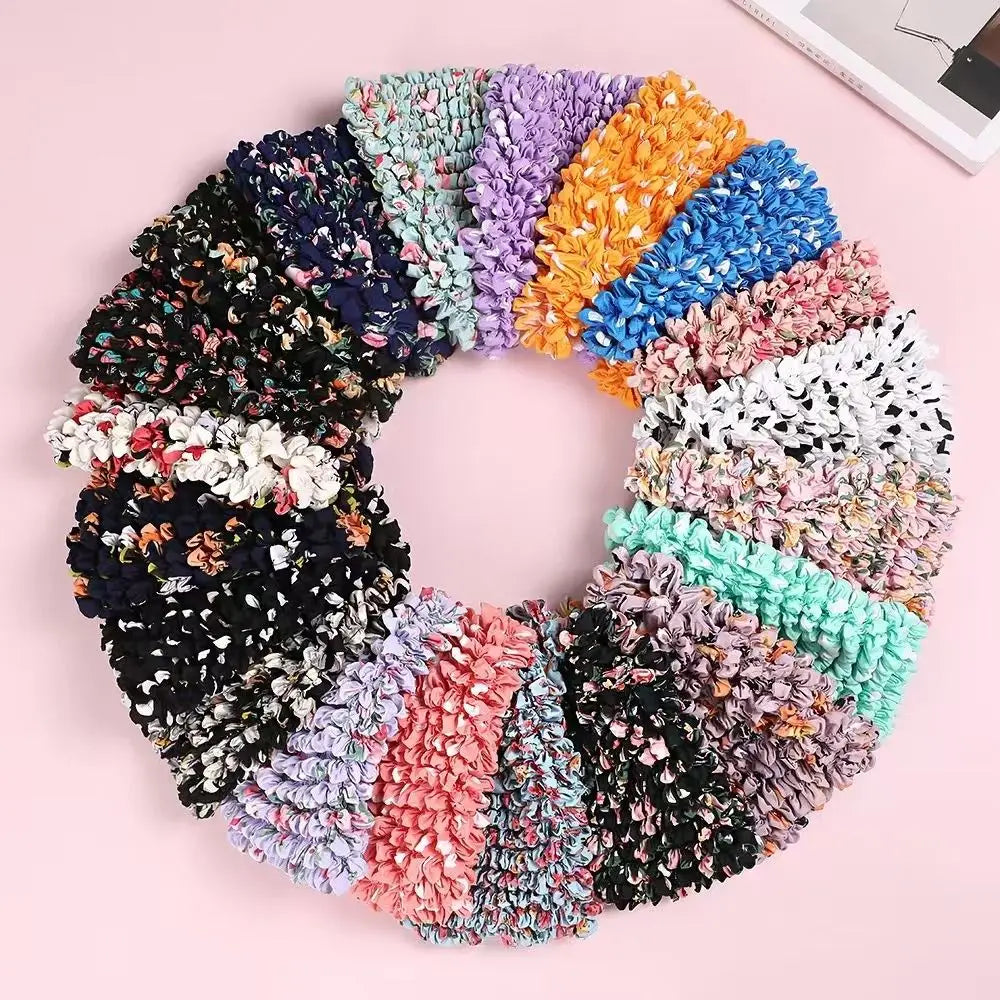 A circular arrangement of colorful, textured fabric or material resembling a reusable foldable bubble shopping bag.