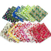 A collection of colorful summer fruit print dog bandanas and triangle scarves made of soft cotton.