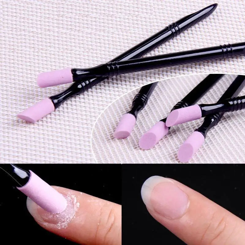 A set of professional black nail files and cuticle remover tools with light purple tips shown on a finger.