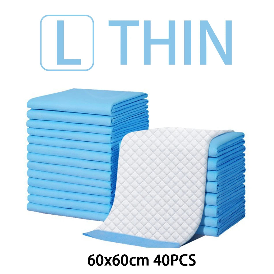 A stack of thin blue disposable absorbent dog diapers, measuring 60x60cm and containing 40 pieces.