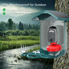 Caméra d'alimentation pour oiseaux étanche IP66 avec mécanisme rouge, montrée à l'extérieur sous la pluie.
