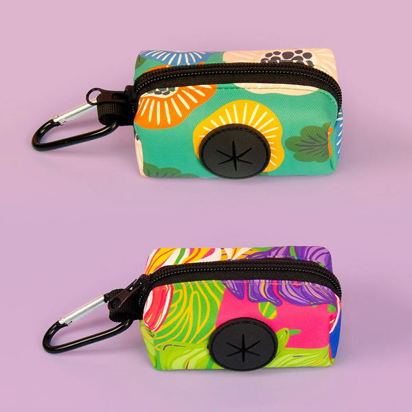 A colorful fabric pouch with a black zipper and metal clip, designed as a stylish dog poop bag holder.