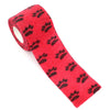 Red fabric pet leggings with black paw prints for walking dogs