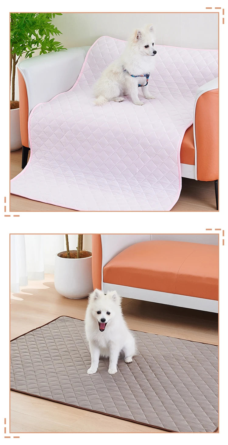A fluffy white dog is sitting on a pink quilted washable cooling mat for dogs.