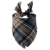 A plaid dog bandana featuring brown, black, and gray tones with fringed ties.