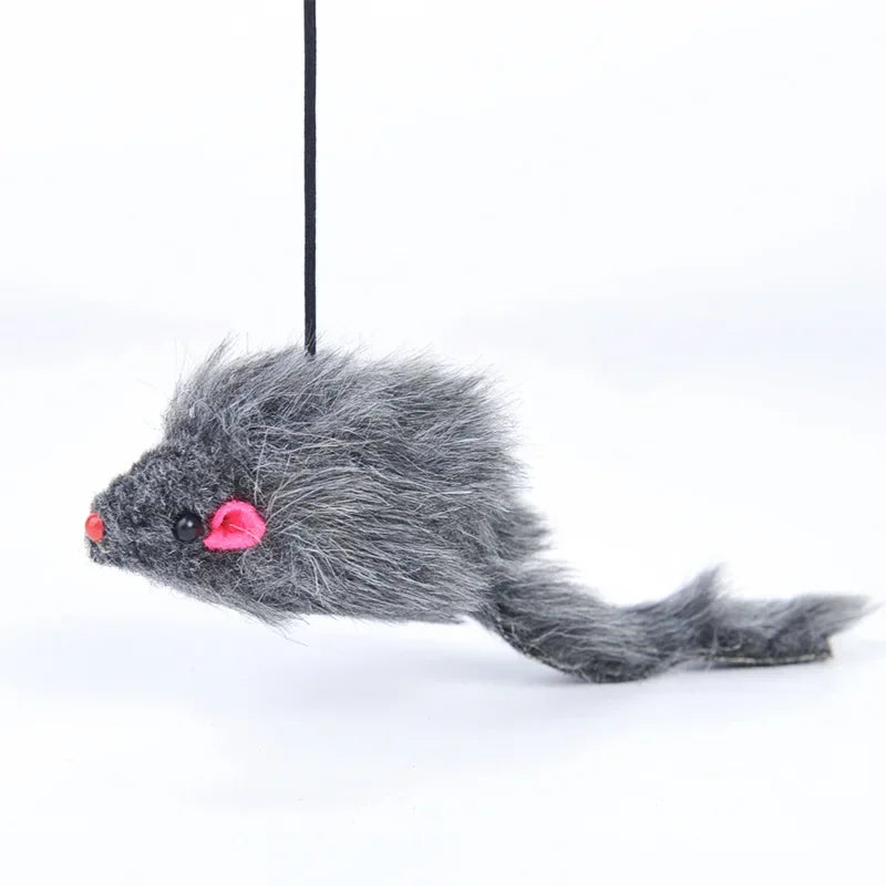 A gray, fluffy cat toy with pink accents hangs from a black string.
