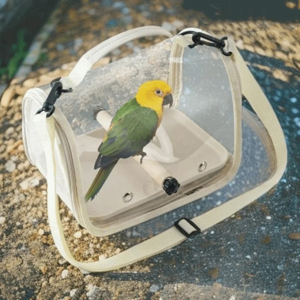 A clear mesh portable bird carrier bag with a wooden stand and a yellow and green parrot inside