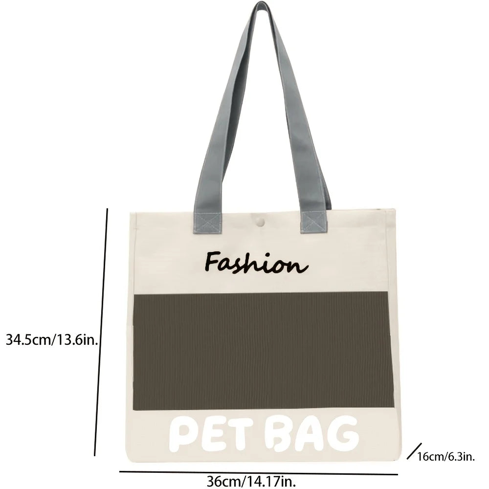 A beige fabric pet bag with black text and a gray strap, shown flat.