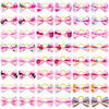 A collection of adorable pet hair bows in various colors and patterns with gentle rubber bands.