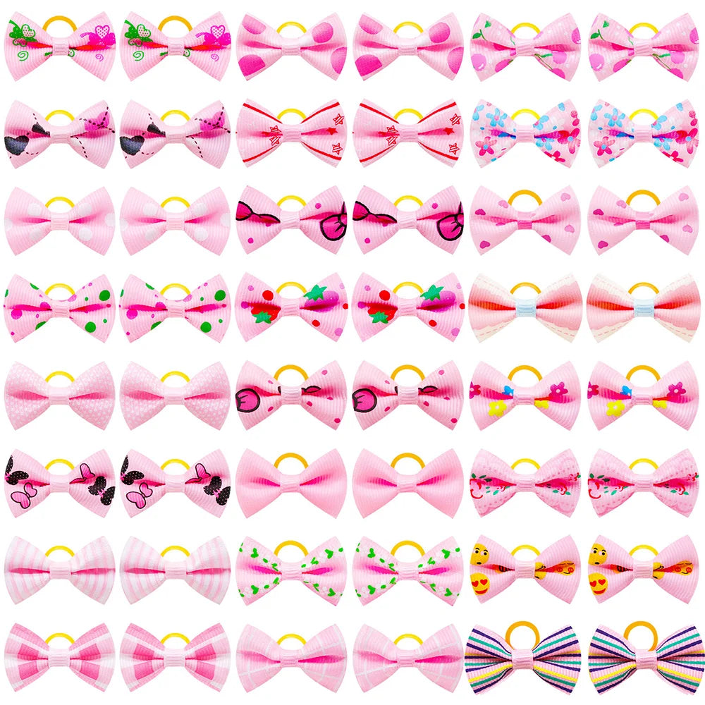 A collection of adorable pet hair bows in various colors and patterns with gentle rubber bands.
