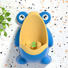 A bright blue frog-shaped potty training trainer with large eyes and a green leaf detail.