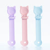 Three long-handled pet food dispensing spoons in lavender, pink, and light blue.