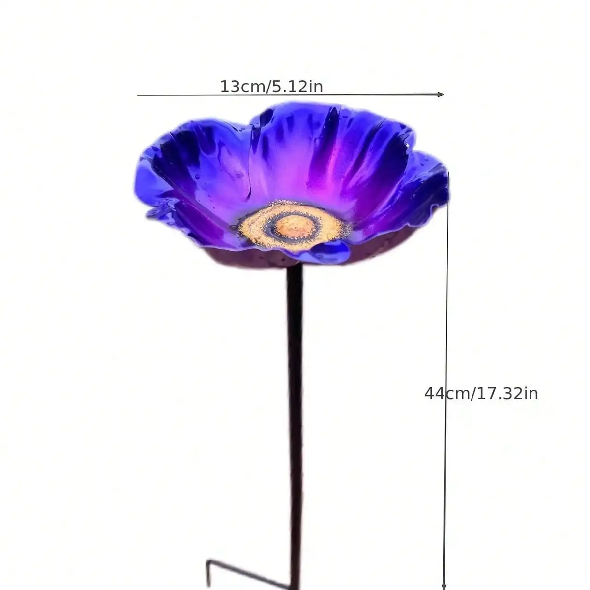 A deep purple flower with a golden center attached to a thin black stem, shown next to a measurement scale.