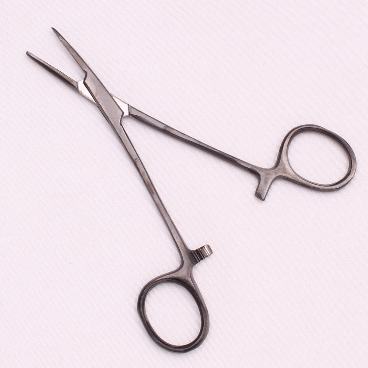 A pair of professional stainless steel pet forceps used for minor injuries.