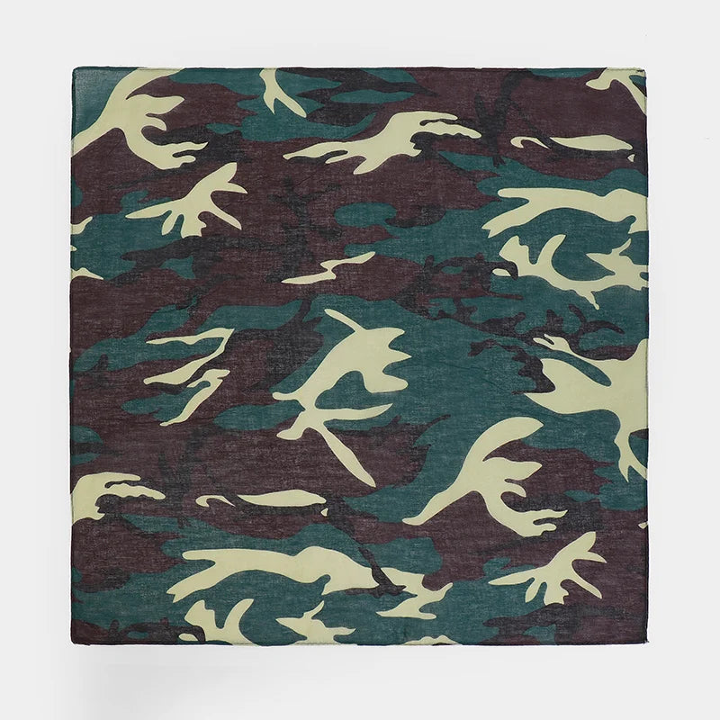 A fabric featuring a camouflage print pattern in shades of green, brown, and olive.