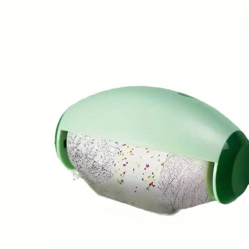 A reusable lint roller in light green with a clear window showing lint.