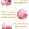 A pink plush squeaky dog toy with a textured surface and built-in generator for making sounds.