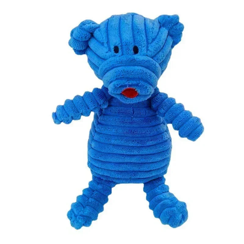 A bright blue corduroy squeaky dog toy shaped like a stylized animal.