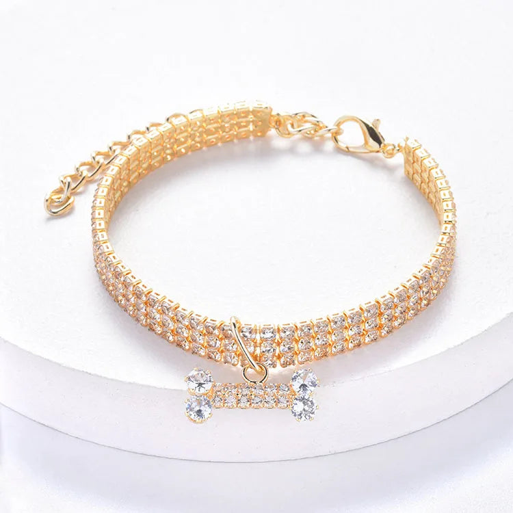 Gold-toned crystal rhinestone pet collar with a bone pendant