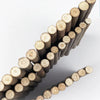 A close-up of natural wood branch chew toys arranged in a diagonal line.