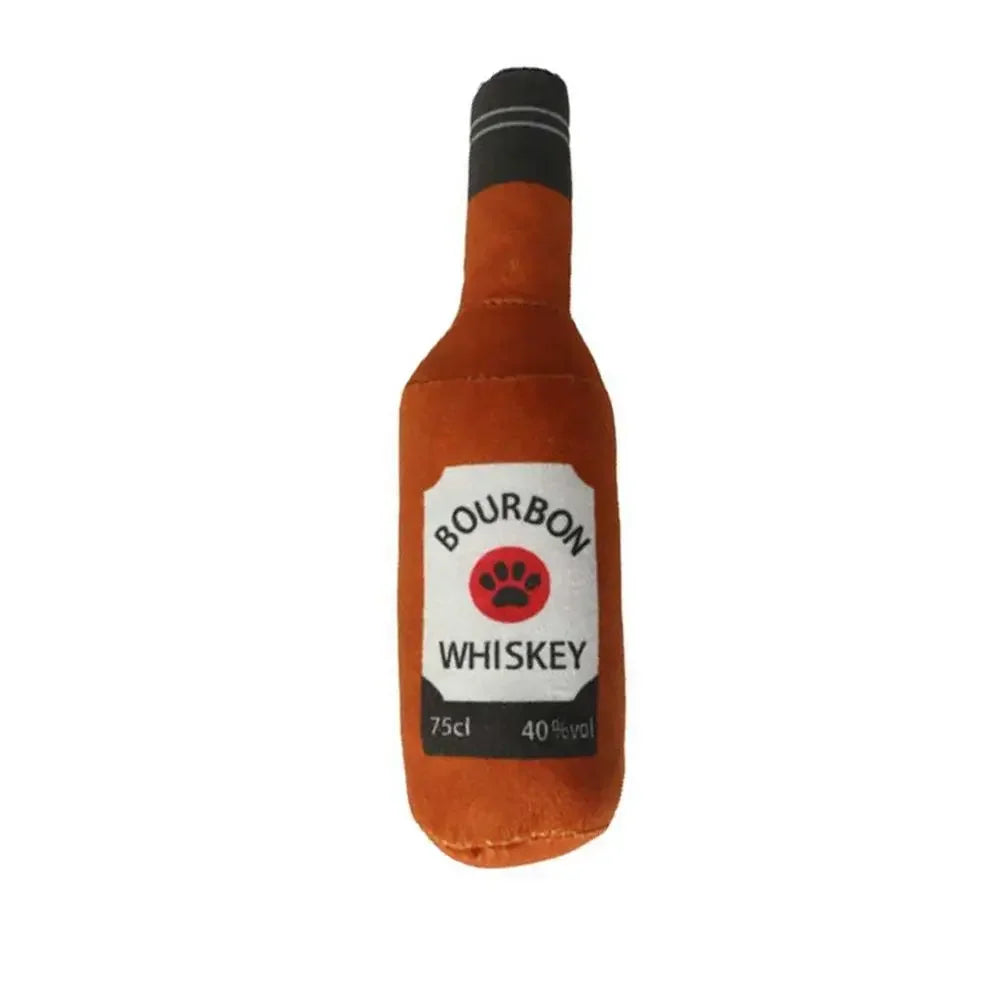 An orange bottle-shaped squeaky plush dog toy labeled Bourbon Whiskey 75cl 40% vol