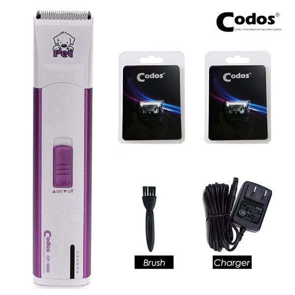 A white and purple electric pet hair trimmer set including the device, brush, and charger.