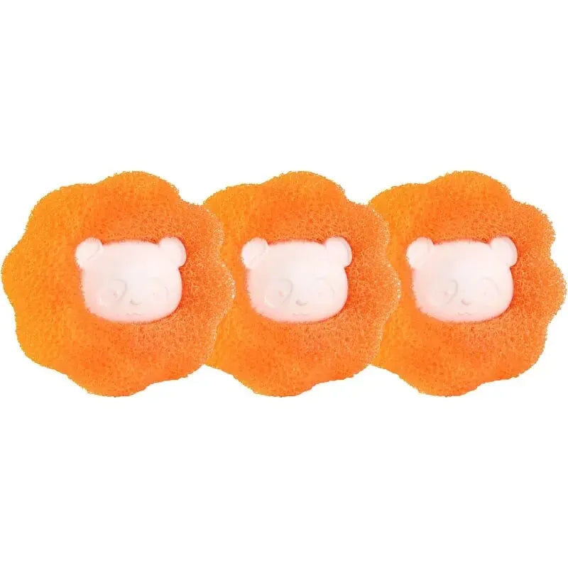 Three bright orange, fluffy pet hair and lint removal balls with white bear faces.