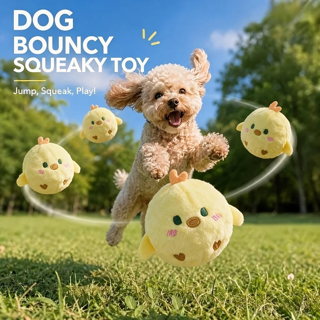A fluffy light-colored dog is playing with a yellow squeaky toy chick ball outdoors.