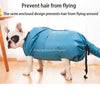 A white dog wearing a blue semi-enclosed drying bag, preventing hair from flying around.