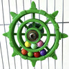 A green interactive parrot spinner rattle toy with colorful balls inside a circular frame.