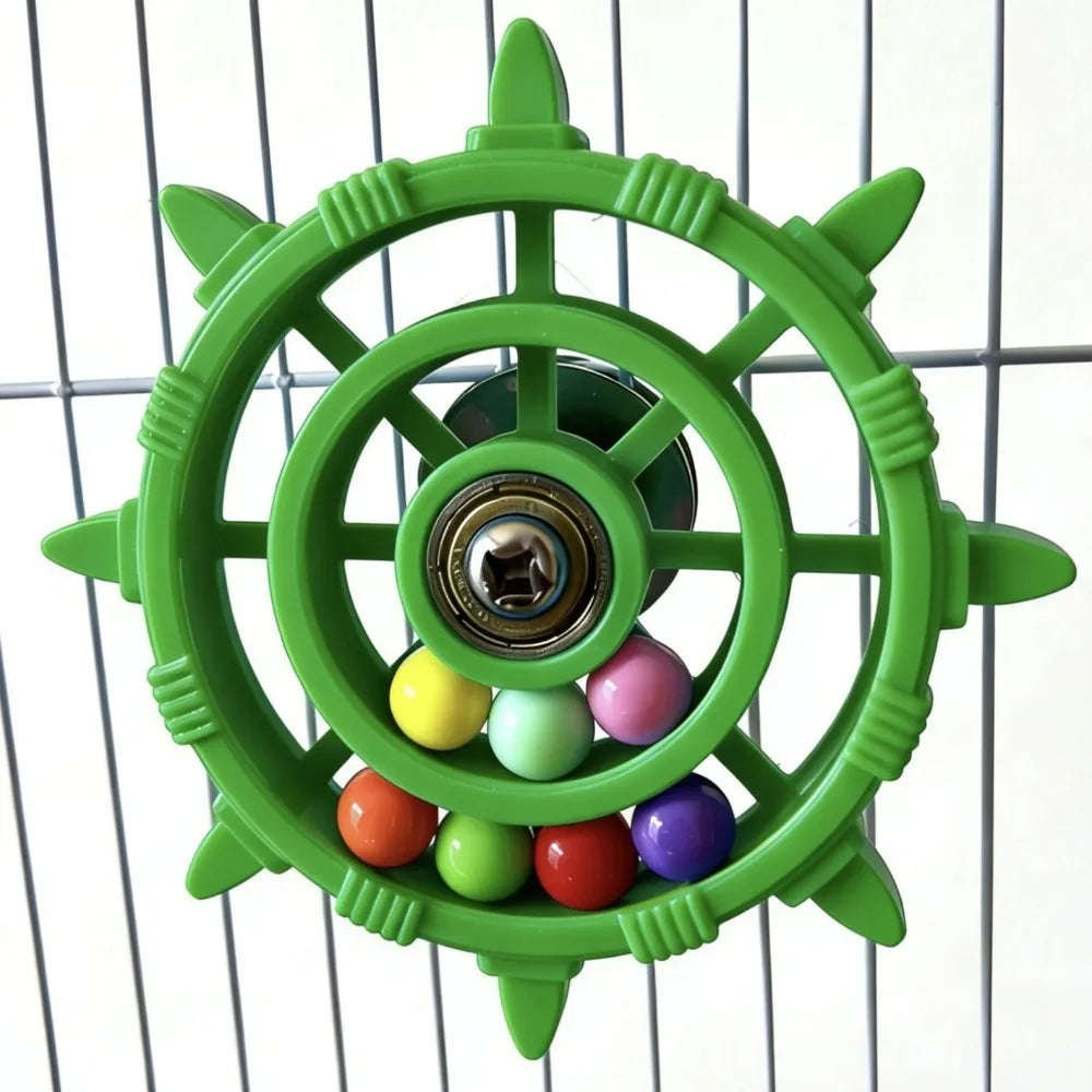 A green interactive parrot spinner rattle toy with colorful balls inside a circular frame.