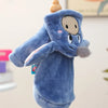 A soft blue flannel hoodie shaped like a dog, featuring a light tan face and gray fur details.