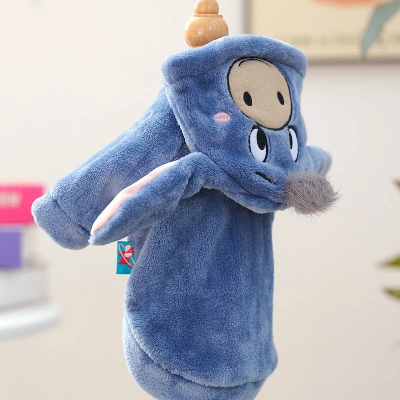 A soft blue flannel hoodie shaped like a dog, featuring a light tan face and gray fur details.