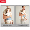 Baby in Insular adjustable hip seat sling, demonstrating hugging and kangaroo styles.