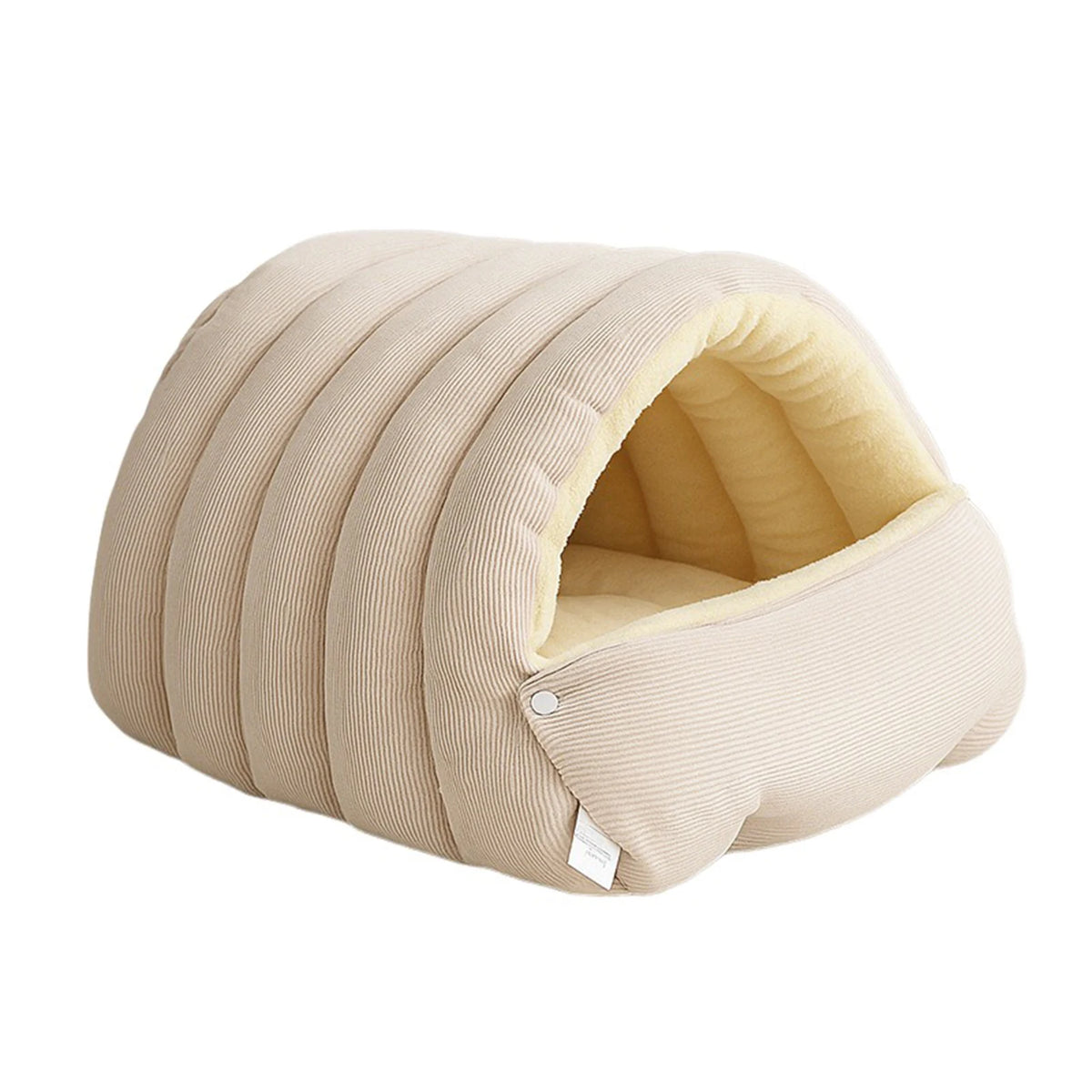 A beige plush cat cave bed with ribbed exterior and a removable inner lining.